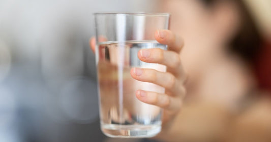 Cheers with a cup of refreshing filtered water