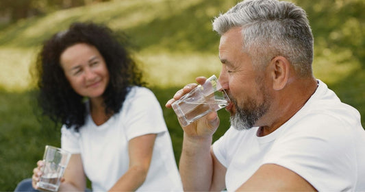 Couple drinking refreshing filtered water