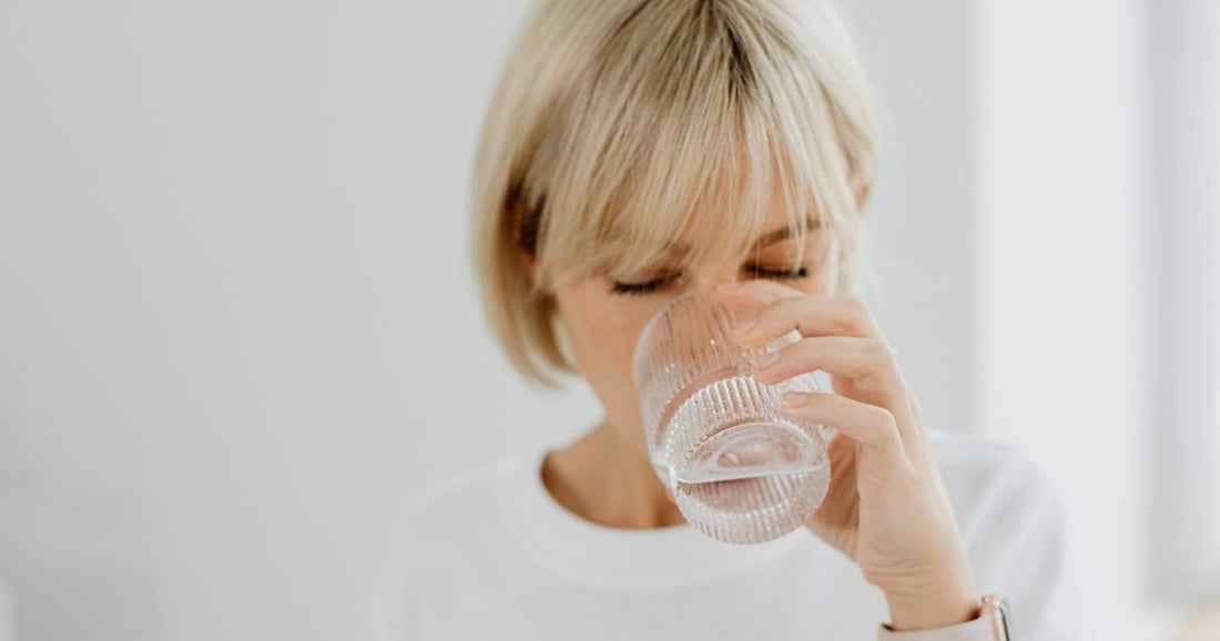 Woman drinking water from a glass